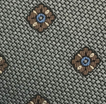 Close-up of the Large Diamond Pattern Tie by Robert Jensen, showcasing a woven gray fabric with evenly spaced brown and blue diamond shapes—perfect for adding personal style to your handcrafted necktie.