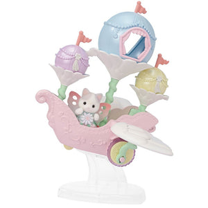 The Calico Critters Floral Fantasy Skyship features Latte Cat Baby dressed in a delicate fairy costume with butterfly wings, seated in a pastel pink and white carnival ride shaped like a carriage with three flower-shaped seats and pastel flags, all displayed on a clear stand.