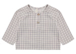 The Quincy Mae Baby Boys’ and Boys’ Zion Shirt, a relaxed-fit long-sleeve top in gray and white plaid organic cotton, with two front buttons and a crew neckline, is shown laid flat on a white background.