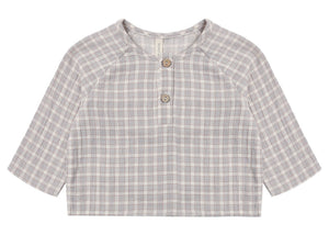 The Quincy Mae Baby Boys’ and Boys’ Zion Shirt, a relaxed-fit long-sleeve top in gray and white plaid organic cotton, with two front buttons and a crew neckline, is shown laid flat on a white background.