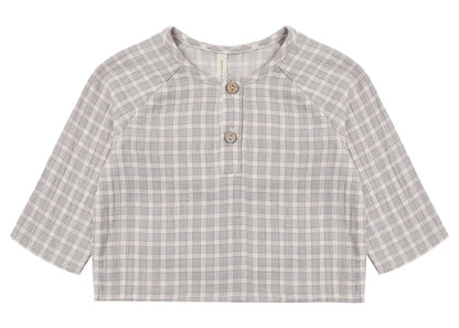 The Quincy Mae Baby Boys’ and Boys’ Zion Shirt, a relaxed-fit long-sleeve top in gray and white plaid organic cotton, with two front buttons and a crew neckline, is shown laid flat on a white background.