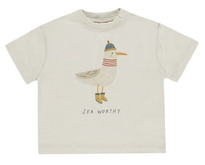 The Rylee & Cru Baby Boys' & Boys' Relaxed Tee is a beige, soft cotton jersey basic featuring a bird in a hat, scarf, and boots with "SEA WORTHY" printed underneath; available in baby sizes.