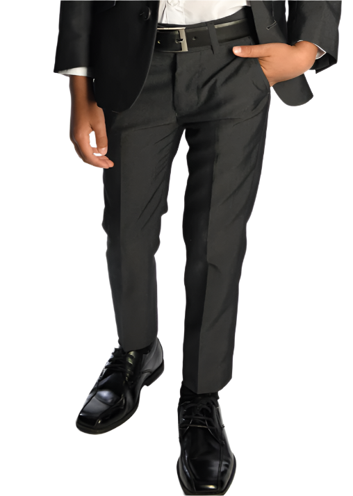 An individual dressed in Appaman Boy's Mod Pant in a dark suit with slim cut pants, wearing a white shirt and black dress shoes, stands with one hand in the pocket against a white background.