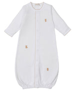 The Kissy Kissy Baby Teddy Bear Time Conv Gown with Hand Emb. is made from soft Peruvian cotton, features long sleeves, beige stitching, and hand-embroidered teddy bear and boot details on the front.