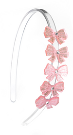 Introducing the Lillies & Roses Bows Glitter Pink Headband—this clear plastic headband is adorned on one side with six pink glittery bows, each featuring a small silver gem in the center. Lightweight and eye-catching, it’s the perfect sparkling party accessory for any occasion.