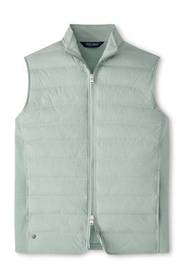 The Peter Millar Winsome Hybrid Vest is a light green, channel-insulated sleeveless vest with a two-way zip front and stand-up collar, shown laid flat on a white background.