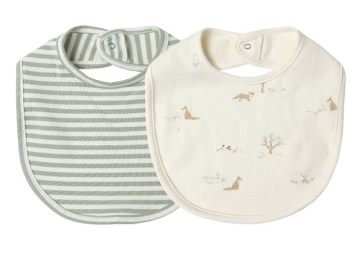 The Quincy Mae Jersey Snap Bib 2-Pack includes one green and white striped bib and one cream bib with animal and tree designs, both made from soft brushed jersey with snap closures.