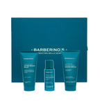 Barberino's Perfect Shaving Set includes after-shave balm, pre-shave oil, and shaving cream in blue containers, elegantly arranged before a matching box for superior men's grooming.