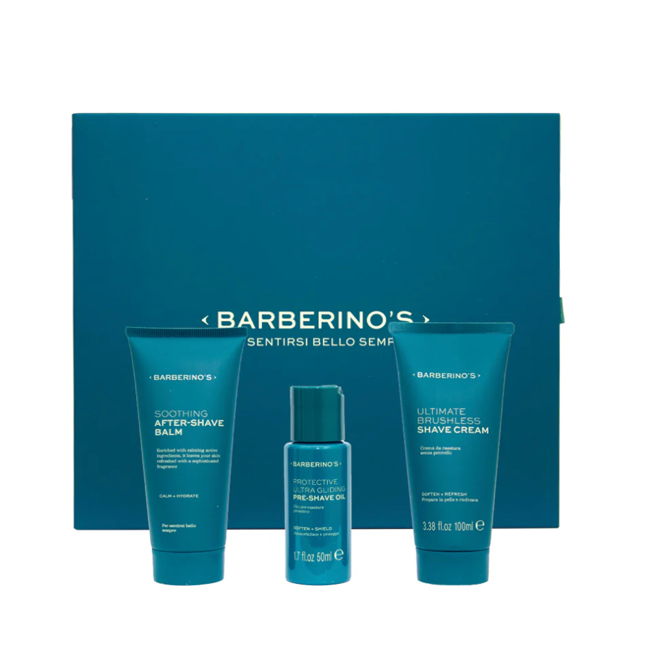 Barberino's Perfect Shaving Set includes after-shave balm, pre-shave oil, and shaving cream in blue containers, elegantly arranged before a matching box for superior men's grooming.