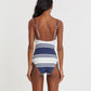 A woman with long dark hair models the Lemlem Elene One Piece, featuring blue and white stripes and adjustable spaghetti straps, shown from the back against a plain white background.