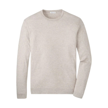 The Peter Millar Lake Long Sleeve Sweater is a lightweight, plain, light beige sweater with long sleeves, shown on a white background.