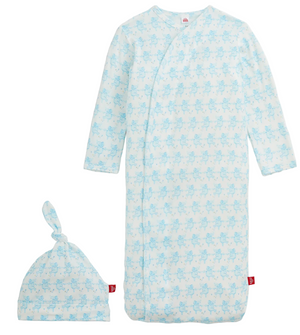 Introducing the Baby Trunkettes Modal Gown + Hat by Magnetic Me—a light blue newborn set featuring long sleeves, a matching hat, and a delicate animal print pattern. The gown is designed with a magnetic closure for effortless changing.