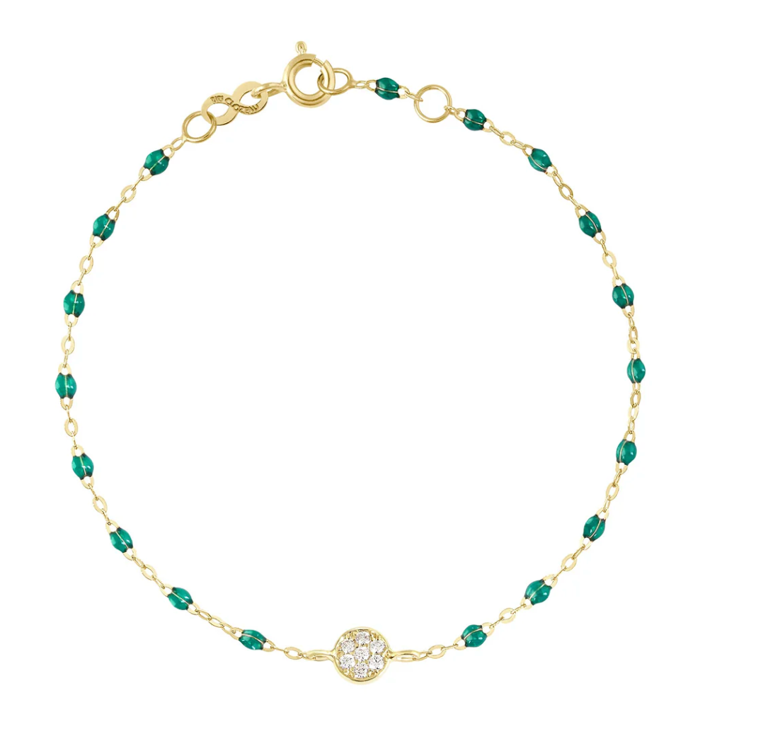 The Gigi Clozeau Puce Diamond Bracelet 6.7" by Gigi Clozeau is elegantly crafted from 18-carat gold, featuring vibrant green beads and a central clear stone in a circular setting.