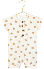Short-sleeve, cream-colored Baby Boys’ Teddy Romper by Lou Lou & Company, featuring an adorable brown bear faces pattern and three dark buttons on the front, displayed on a gold hanger—a charming one-piece perfect for your little one’s comfort.