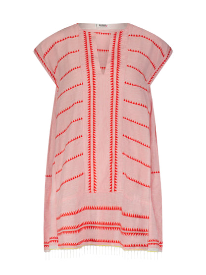 The Lemlem Elina Caftan, a sleeveless knee-length tunic, features an A-line shape with red zigzag and stripe patterns on hand-spun cotton. It has a V-neck, tibeb weaving, and fringe at the hem, combining style with artisanal craftsmanship.