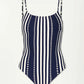 The lemlem Elene One Piece by Lemlem is a classic swimsuit with vertical black and white stripes, adjustable spaghetti straps, and an interior shelf bra for support.