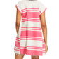 A person is shown from the back wearing the Lemlem Elina Caftan, a hand-woven cotton short dress featuring horizontal pink and white stripes with a fringed hem.