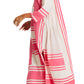 A woman models the Lemlem Fana Caftan—long, loose-fitting with pink and white stripes—paired with flat sandals and gold jewelry, walking sideways against a white backdrop for a look that's effortlessly versatile.