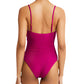 Person seen from the back wearing the Lemlem Elene one-piece swimsuit in magenta, featuring adjustable spaghetti straps.