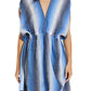 A woman wears the Lemlem Alem Dress, a hand-spun cotton short dress with a sleeveless deep V-neck and vertical blue, white, and black stripes—ideal for resort wear.