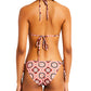 Rear view of a person wearing the Lemlem Malia Top and Rekka Bottom Bikini, featuring a colorful pattern with string ties and a halter neck.