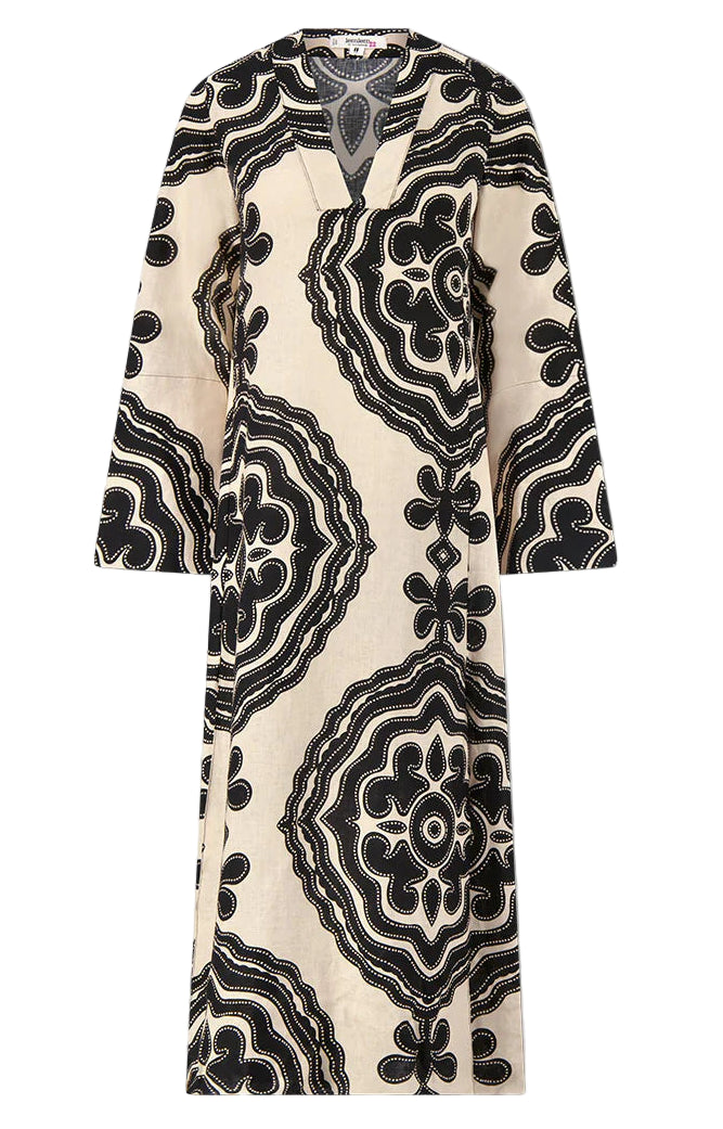 The Lemlem Theodora Column Dress is a long-sleeved, cream linen maxi with a V-neck and bold black geometric patterns for a striking bohemian look.