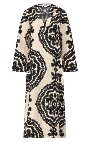 The Lemlem Theodora Column Dress is a long-sleeved, cream linen maxi with a V-neck and bold black geometric patterns for a striking bohemian look.