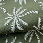 Crafted by Lemlem, the Retiro One Piece is made from premium jacquard green fabric featuring white palm tree motifs, ideal for elegant designs like a V-neck or cross-back.