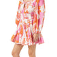 A woman wearing a long-sleeve, floral-patterned Rhode Leona Dress in pink, orange, and white, with a square neckline and fitted waist, crafted from soft Cotton Cambric Fabrication.