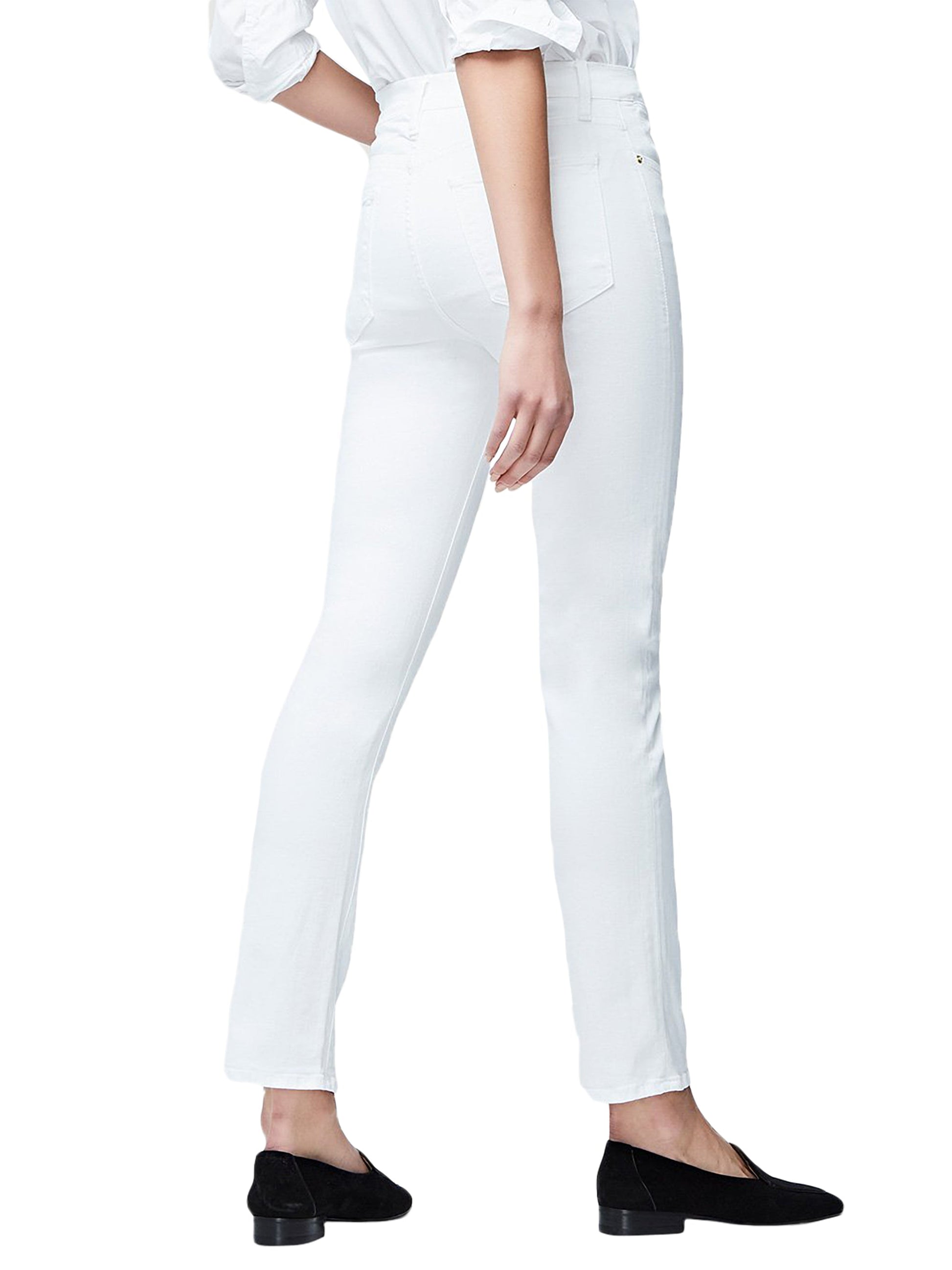 Woman in a white blouse and Frame Le High Straight denim jeans, viewed from the side, standing against a white background.