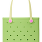 A light green Baby Bogg® Bag tote from Bogg Bags, featuring evenly spaced holes, cream-colored handles with pink accents, and the word “bogg” printed in pink in the lower corner. This durable bag is fully washable for easy care and long-lasting use.