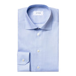 A neatly folded Contemporary Houndstooth Fine Twill Shirt by Eton, featuring white buttons and a visible Eton brand label, displayed on a white background.