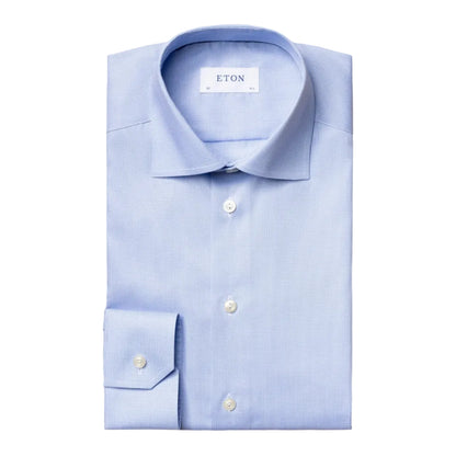 A neatly folded Contemporary Houndstooth Fine Twill Shirt by Eton, featuring white buttons and a visible Eton brand label, displayed on a white background.