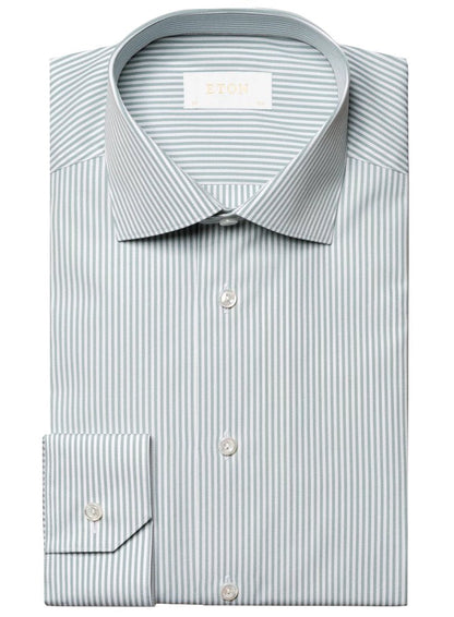 A folded grey and white Bengal stripe button-up dress shirt, crafted from luxurious organic Supima cotton, labeled "Eton" inside the collar.