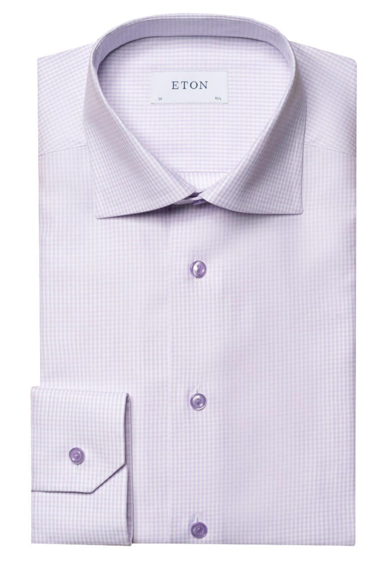 A neatly folded Eton Light Purple Checked Shirt, crafted from Cotton & TENCEL™, with a label inside the collar that reads "ETON." The shirt features a classic micro-check pattern, an elevated essential with a classic collar and buttoned cuffs in a slim fit.