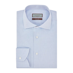 Canali Impeccabile Regular Fit Shirt in light blue, a long-sleeved dress shirt in cotton with a spread collar and buttoned cuffs, folded flat.