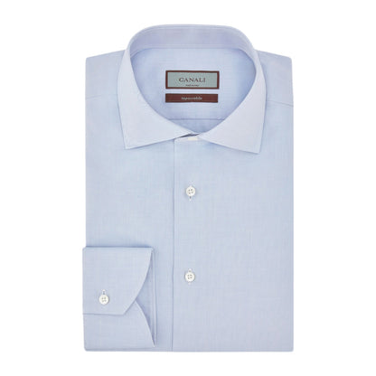 Canali Impeccabile Regular Fit Shirt in light blue, a long-sleeved dress shirt in cotton with a spread collar and buttoned cuffs, folded flat.