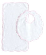 The Terry Tots Bib & Burp Set features a white scalloped-edge bib and matching burp cloth with delicate pink trim, displayed on a white background—an ideal choice for adding both style and practicality to feeding time.