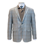 The Canali Kei Lined Grey/Brown Plaid Blazer is shown on a mannequin over a brown collared shirt, white dress shirt, and black dotted tie.