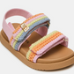The Steve Madden Kids Toddlers’ Mona Sandal features a tan sole, pink fabric strap, and rainbow-colored crochet straps with a gold buckle and Velcro closures—making this charming slingback perfect for little feet on sunny days.