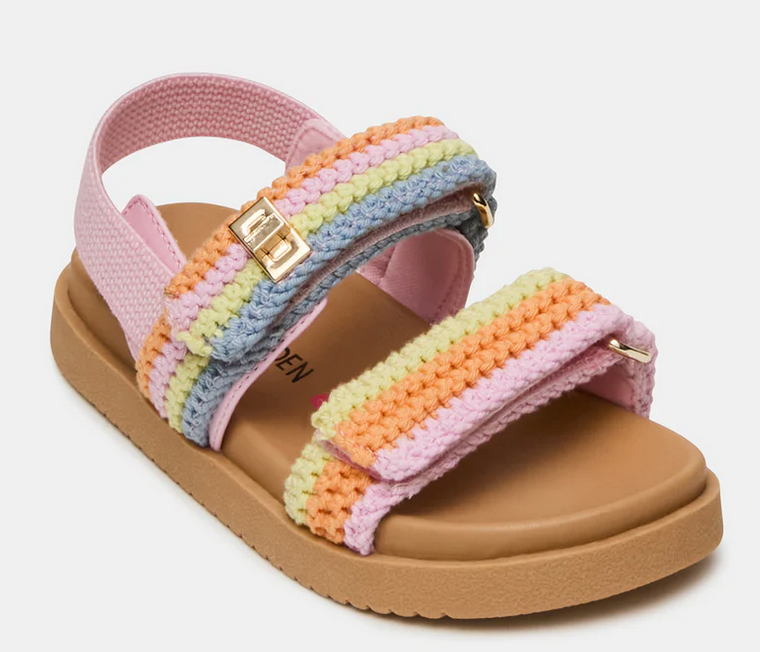 The Steve Madden Kids Toddlers’ Mona Sandal features a tan sole, pink fabric strap, and rainbow-colored crochet straps with a gold buckle and Velcro closures—making this charming slingback perfect for little feet on sunny days.