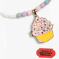 The Super Smalls Cupcake Lipgloss Locket is a beaded kids necklace featuring a cupcake-shaped keepsake locket with colorful gems and a red label that says, "REVEAL A SECRET MESSAGE!.