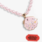 The Super Smalls Sparkle Shell Lipgloss Locket is a pink beaded necklace featuring a seashell-shaped jeweled locket. A red label reads, "REVEAL A SECRET MESSAGE!.