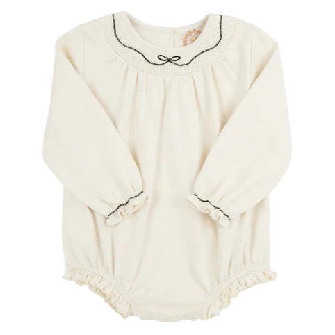 The Beaufort Bonnet Company’s Baby Girls' Long Sleeve Bridget Bubble is a cream romper with black trim and ruffle accents on the collar, cuffs, and leg openings, offering a classic smocked bubble style.