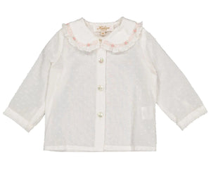 The Kidiwi Baby Girls' Lorena Blouse is an off-white plumetis long-sleeved shirt with a pink-trimmed Peter Pan collar, delicate ruffles, and front button closure.