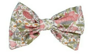 The Kidiwi Bonnie Hair Clip is a large bow adorned with a floral print in pink, green, and grey on a crisp white background.