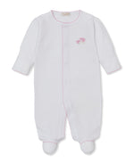 The Kissy Kissy Baby Premier Sweet Sheep Footie is a white long-sleeve footed onesie from the Sweet Sheep Collection, crafted from soft Peruvian cotton. It features delicate pink stitching and small pink flower hand embroidery on the left chest.