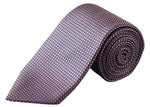 The Eton Geometric Woven Silk Tie features a textured micro geometric motif in shades of purple and pink, elegantly rolled and displayed against a white background—an ideal choice for formal occasions.