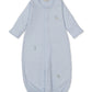 The Kissy Kissy Baby SCE Safari Party Striped Convertible Gown, shown laid flat on a white background, features soft light blue Peruvian cotton with long sleeves, an elasticized bottom, and charming small embroidered animal designs on the front.