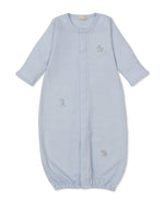 The Kissy Kissy Baby SCE Safari Party Striped Convertible Gown, shown laid flat on a white background, features soft light blue Peruvian cotton with long sleeves, an elasticized bottom, and charming small embroidered animal designs on the front.